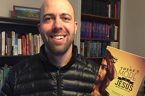 Shawn Brace with his book There's More to Jesus