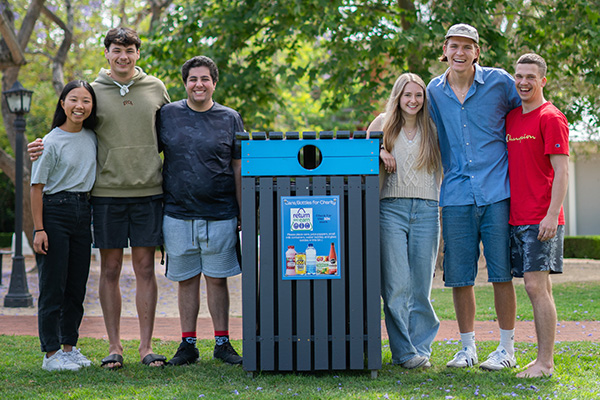Avondale University students with a Return and Earn bin
